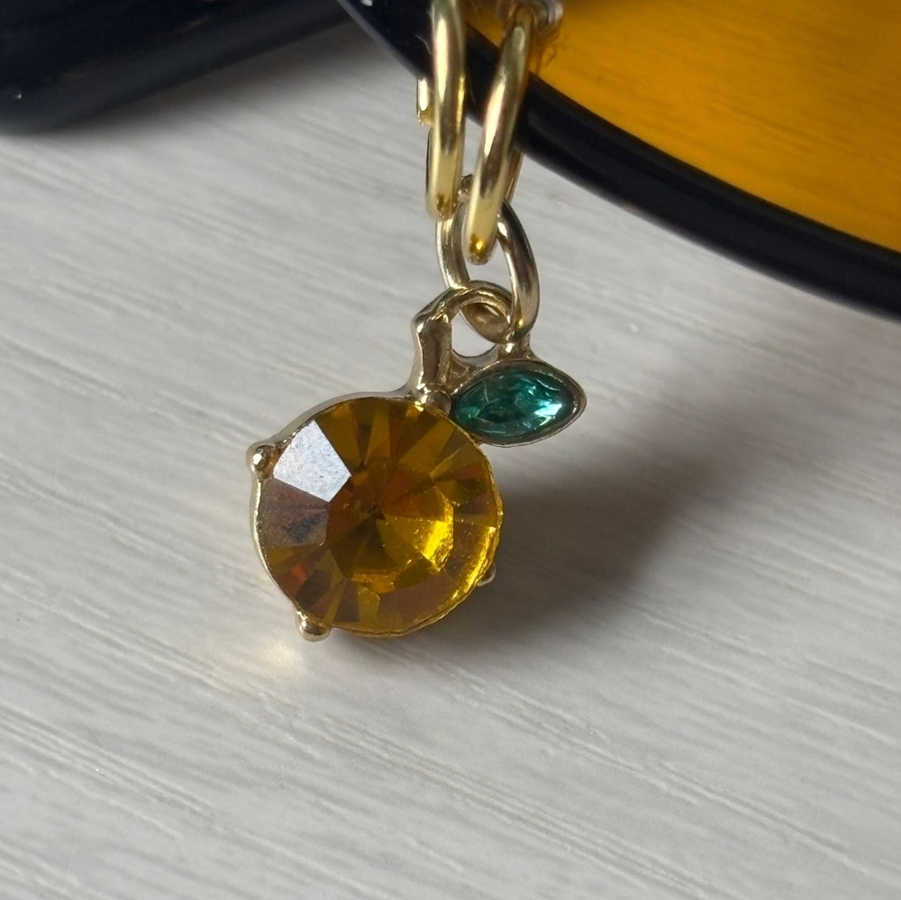 Black Oval Cat Eye Orange Shade Sunglasses Gold Piercings and Orange Fruit Charm - Picture 4 of 5